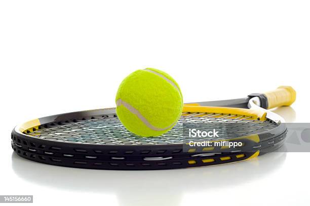 Yellow Tennis Ball Resting On A Tennis Racket Stock Photo - Download Image Now - Backgrounds, Copy Space, Equipment