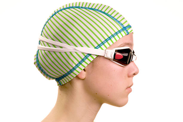 Swimmer profile with cap and goggles stock photo