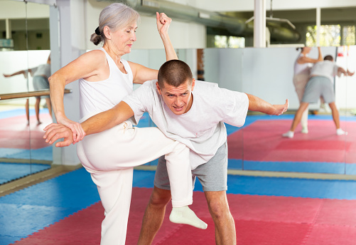 Mature couples dancing at a class in a dance studio