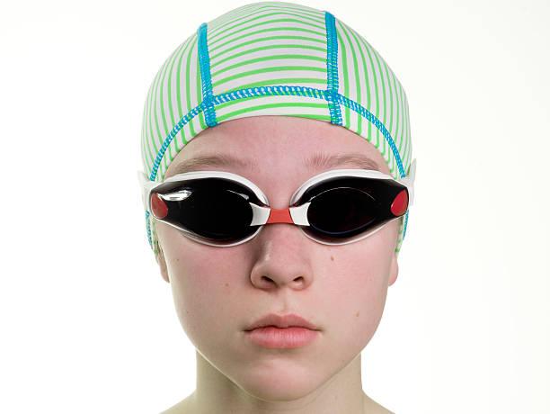 Swimmer with cap and goggles stock photo