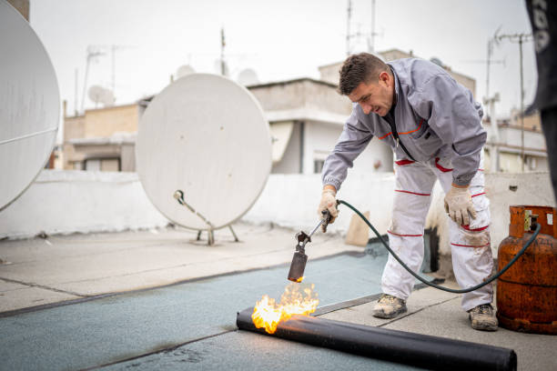 istock Roll roofing Installation with propane blowtorch during construction works 1451576381