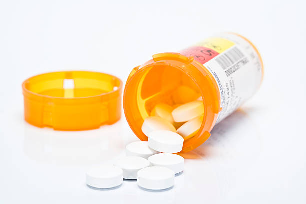 istock Opened orange bottle of prescription pills 145157652