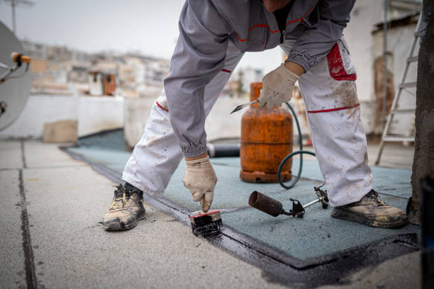 istock Roll roofing Installation with propane blowtorch during construction works 1451576544