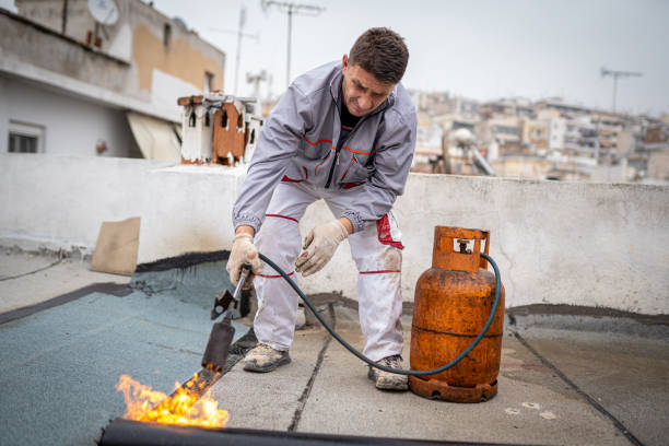 istock Roll roofing Installation with propane blowtorch during construction works 1451576752