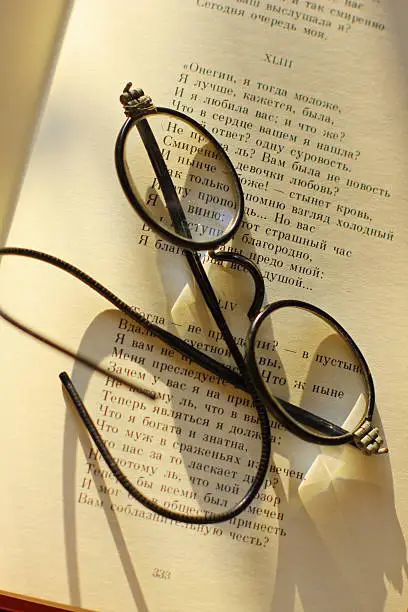 glasses on the book, eyeglasses