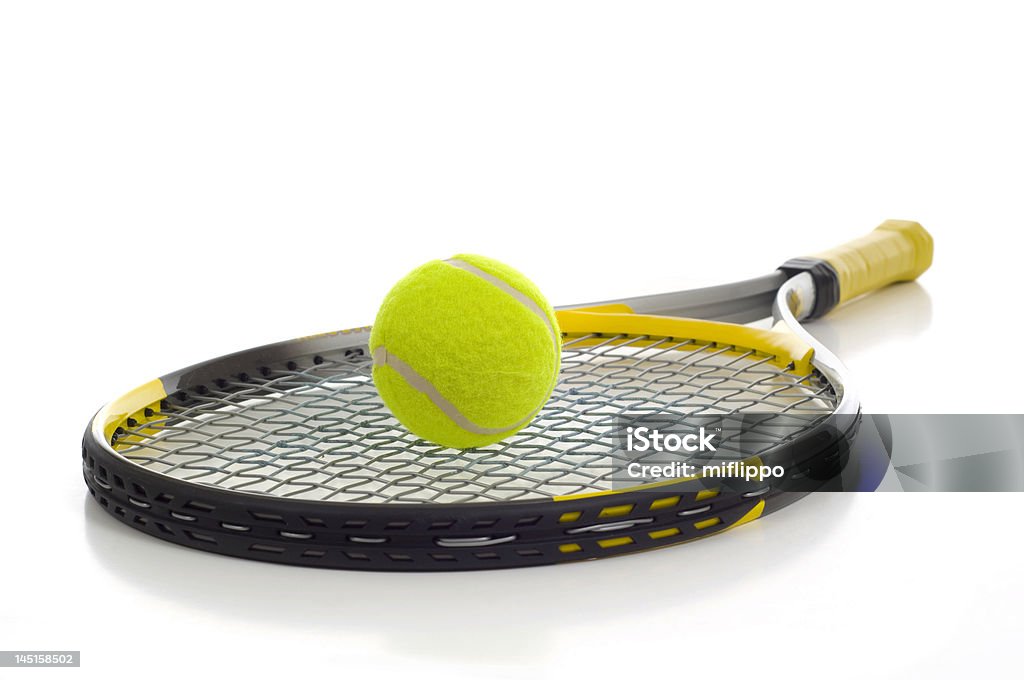 Tennis Ball and Racket A new tennis ball and racket on a white background with copy space Tennis Racket Stock Photo