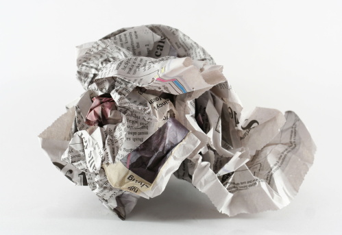 crumpled newspaper