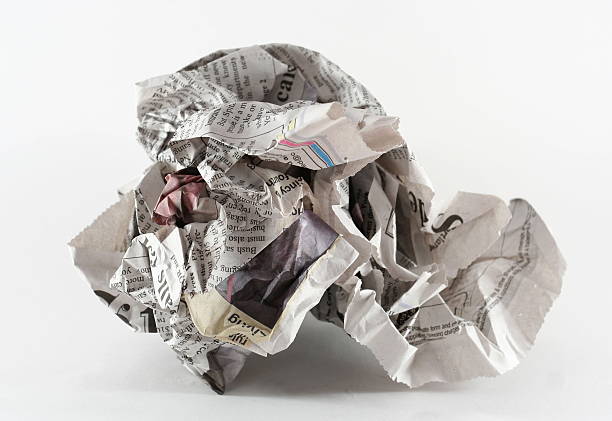 crumpled newspaper stock photo
