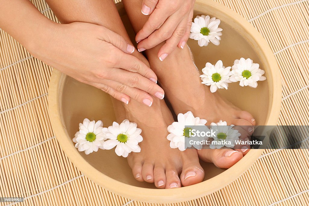 relaxing moments beautiful legs and hands with perfect french pedicure Pedicure Stock Photo