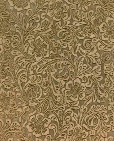 Suede pattern is floral with negative spaces that are burnished so the pattern seems embossed.