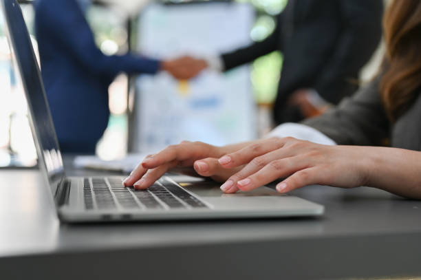 istock close-up, side view image, A businesswoman using laptop computer, typing on keyboard 1451611909