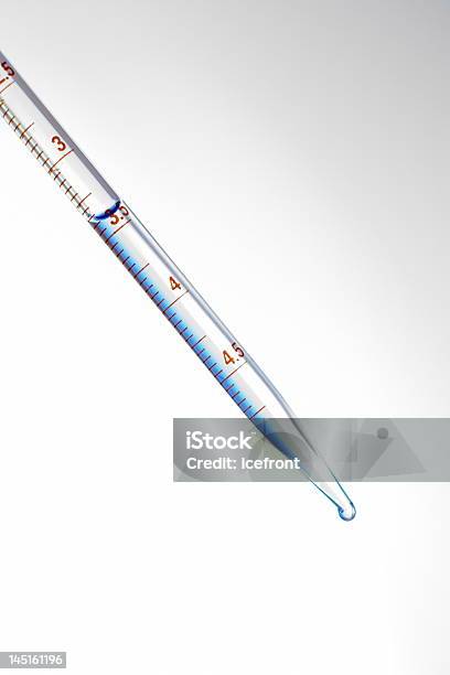 Water Drips From A Pipette Isolated On A White Background Stock Photo - Download Image Now