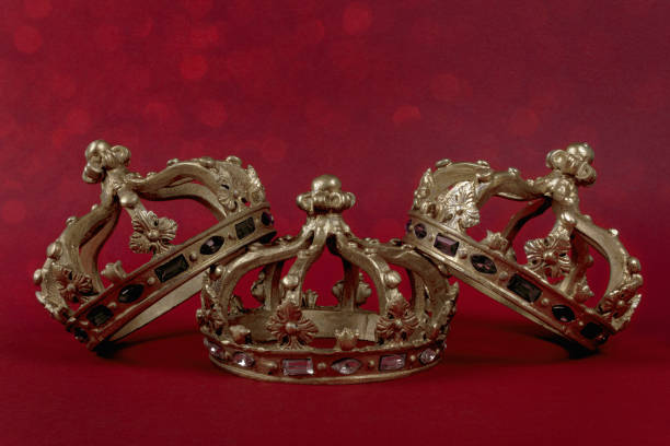 istock Happy Three King's Day. Three gold crowns on red background. Concept for Reyes Magos, Three Wise Men or Happy Epiphany day. 1451614953