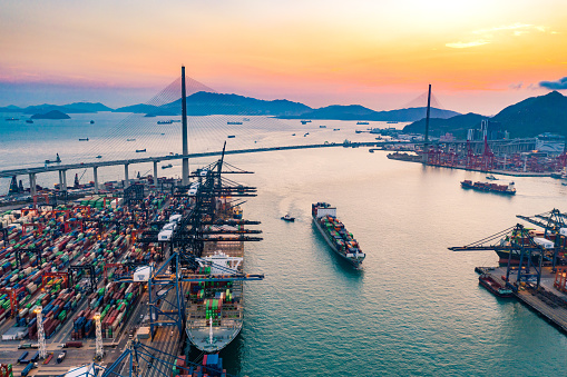 Cargo Ship at Sunset in Port of Container port  in Hong Kong