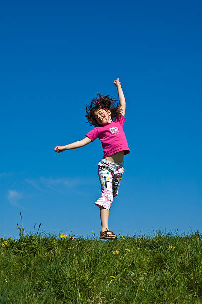 istock Young girl jumping 145162081