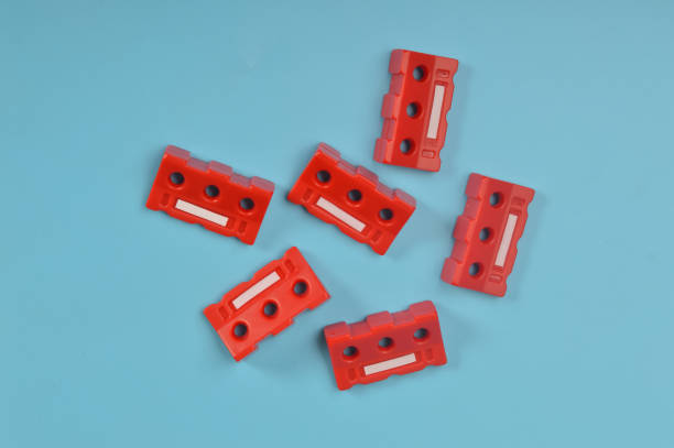 istock Red safety barricades isolated on a blue background. 1451621682