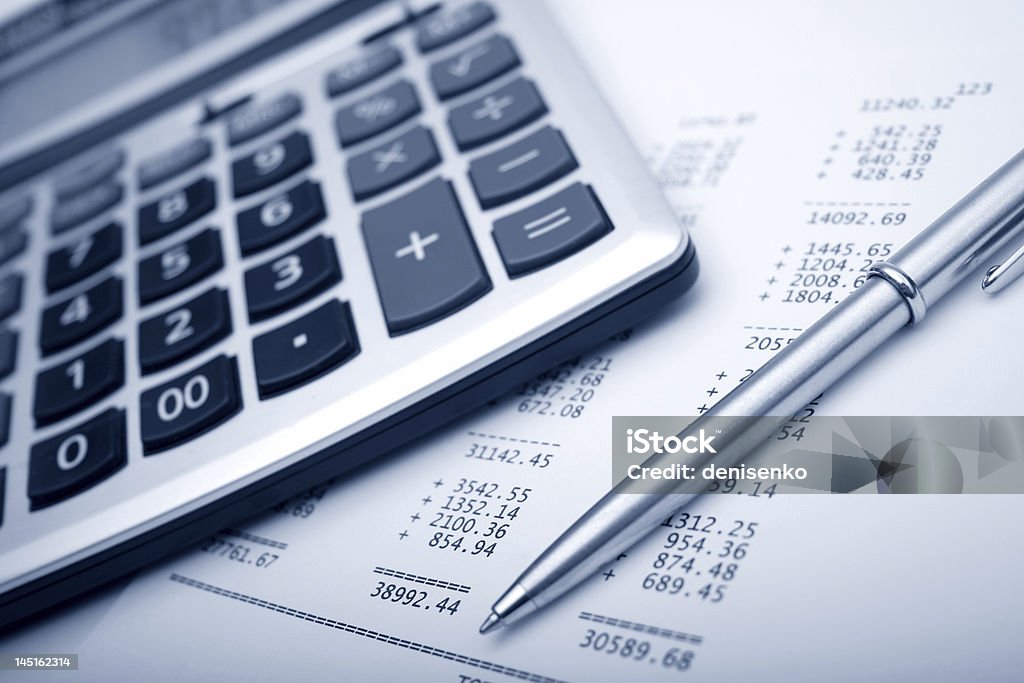 Calculator, pen and business balance business balance Calculator Stock Photo