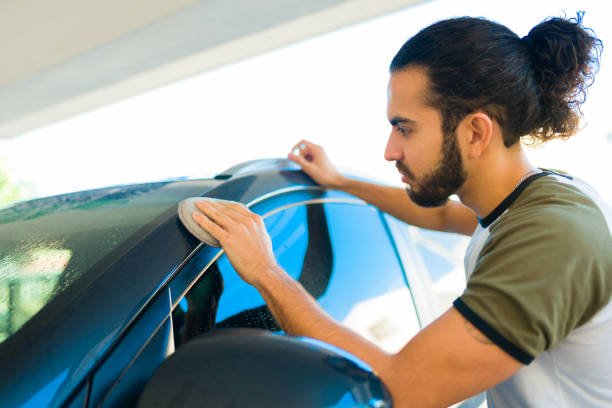 istock Latin young man polishing his car 1451624388