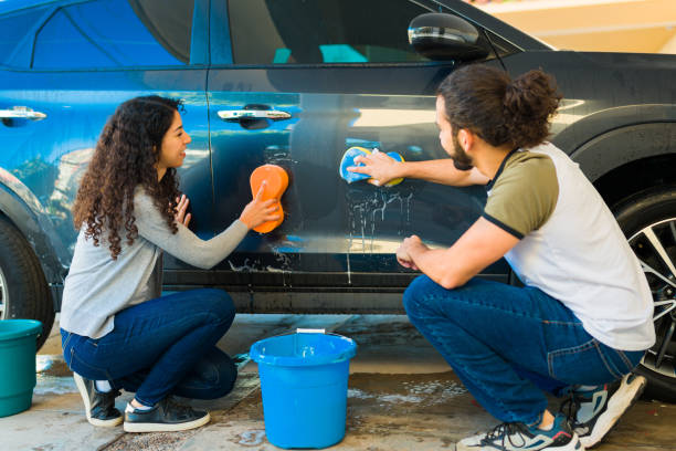 istock Hispanic couple washing their car 1451624491