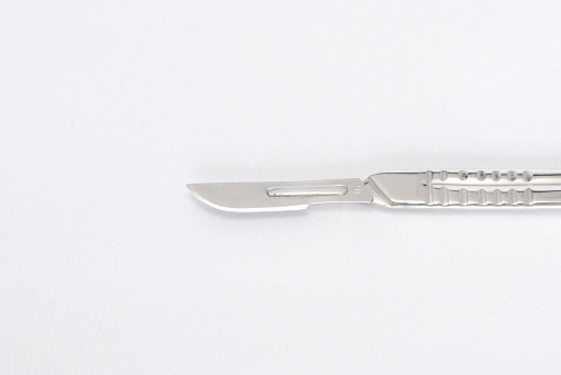 Isolated surgeon's stainless steel scalpel used from incisions