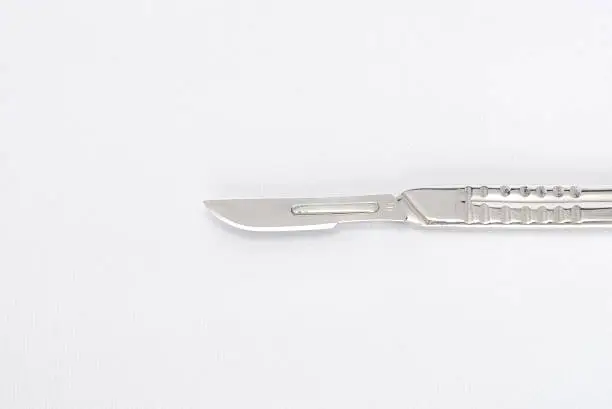 Isolated surgeon's stainless steel scalpel used from incisions