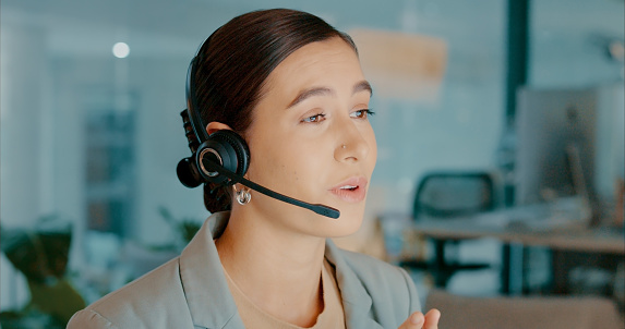 Call center, customer service and woman consulting with microphone for expert communication online. Internet, technology and customer service with professional employee talking to client.