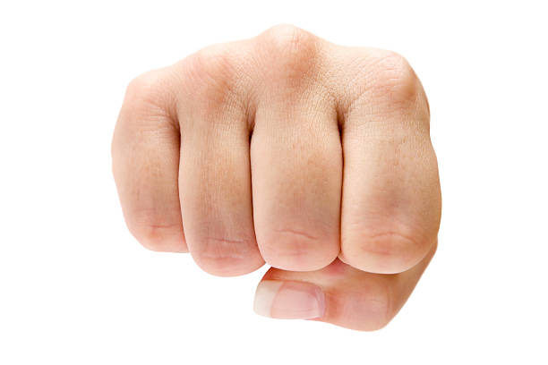 Fist Female fist isolated on a white background. fist human hand punching power stock pictures, royalty-free photos & images