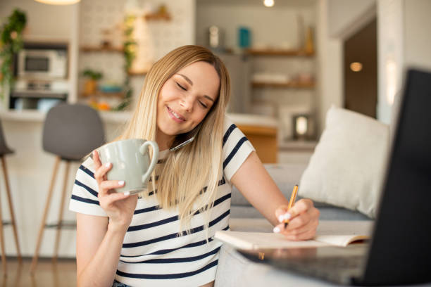 istock Young woman working from home 1451639135