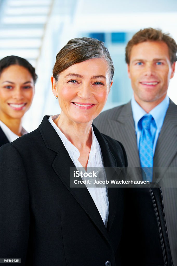 Business team and with their leader Business team and with their leader. 20-29 Years Stock Photo