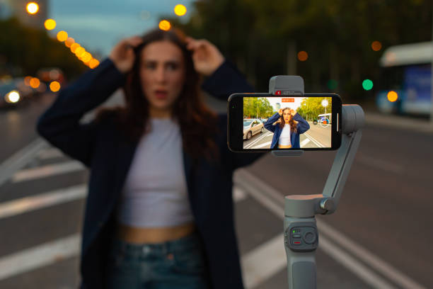 istock Woman taking selfie on road 1451639761