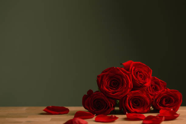 istock bouquet of red roses on green background 1451639829