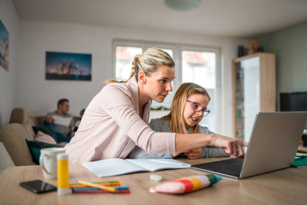 istock Homeschooling Early Afternoon, Caucasian Family Learning by Using Laptop 1451644040