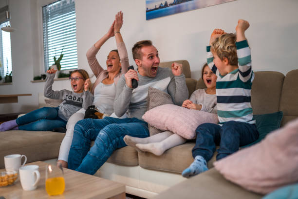istock White Father and Young Son Looking at Each Other While Cheering 1451644116