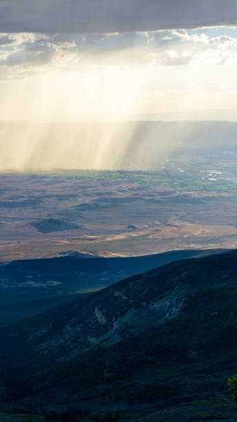 istock Rain clouds in the distance falling into a valley 1451647217