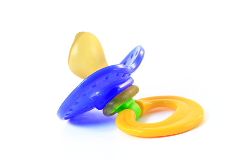 A baby's pacifier, isolated on a white background.