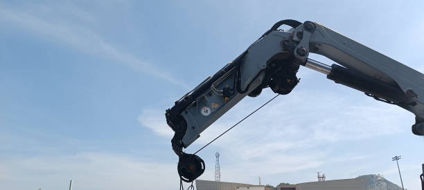 istock Crane machinery to lift heavy things It's a machine on a ship. 1451659759
