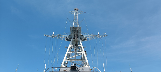 Steel poles attached to the ship to connect the wires and military equipment