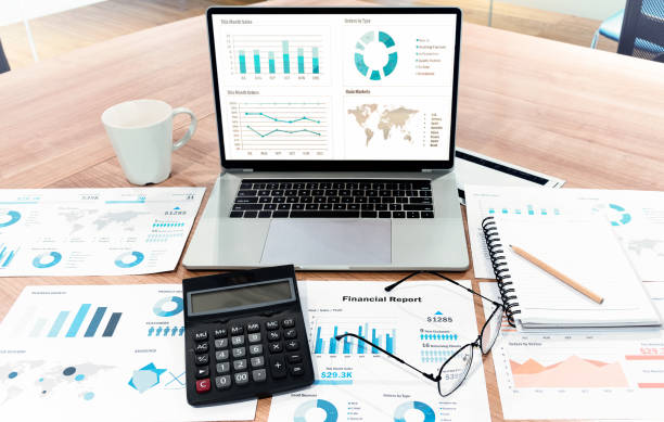 istock Top view slide show presentation on display laptop with calculator ,glasses and paperwork on table in meeting room 1451661895