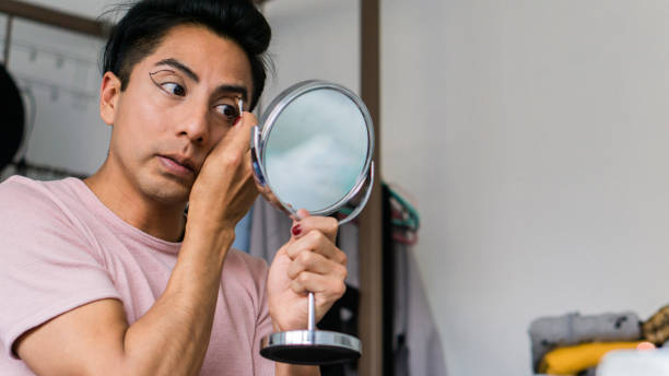 istock Latin brunette in her room doing her make-up for work. Lifestyle. 1451666902