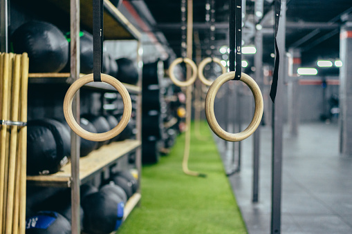 Selective focus on a set of rings for exercising hanging in a gym