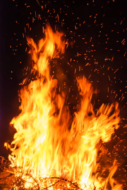 istock Abstract blaze fire flame texture for banner background. Fire sparks particles with flames isolated on black background. Beautiful flames. Fuel, power and energy 1451674412