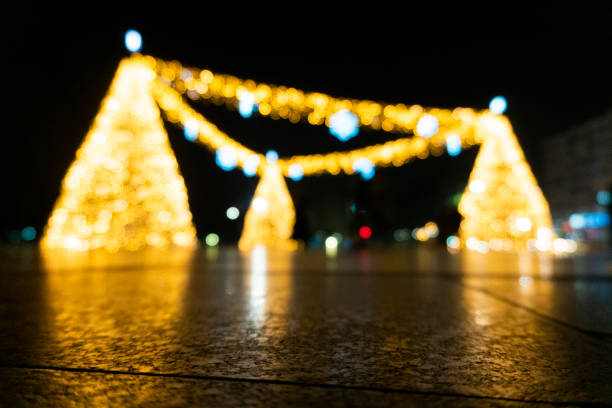 They decorated the streets with lights for New Year's Eve. A blurry and bokeh view of Christmas lights.