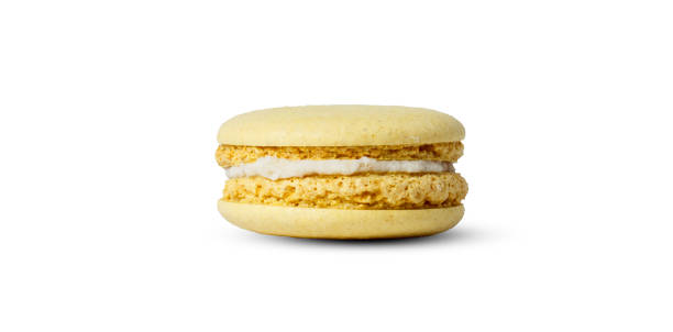 istock Yellow lemon macaron isolated on white background. with a shadow 1451685019
