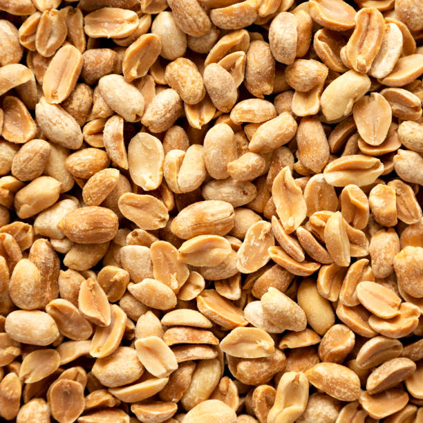 istock Roasted Salted Shelled Peanuts, top view. Close-up. 1451685903