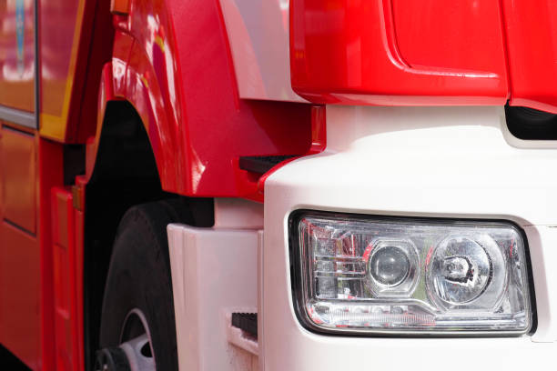 istock Headlight of red fire truck. Modern fire fighting vehicle 1451686545