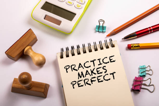 istock Practice Makes Perfect. Stationery on a white office table 1451686965