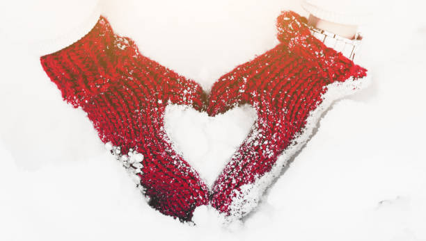 istock Woman hands in winter mittens 1451692062