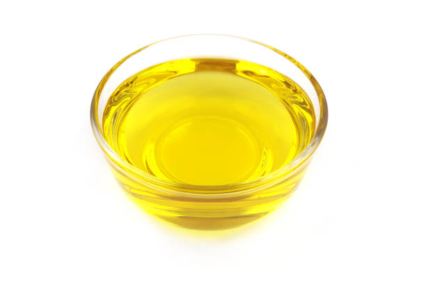 istock Cooking oil in bowl isolated on white 1451694693