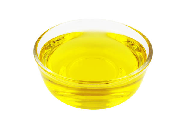 istock Cooking oil in bowl isolated on white 1451694702