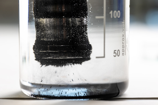 Iron nanoparticles in a lab, being used to clean water from toxic pollutants